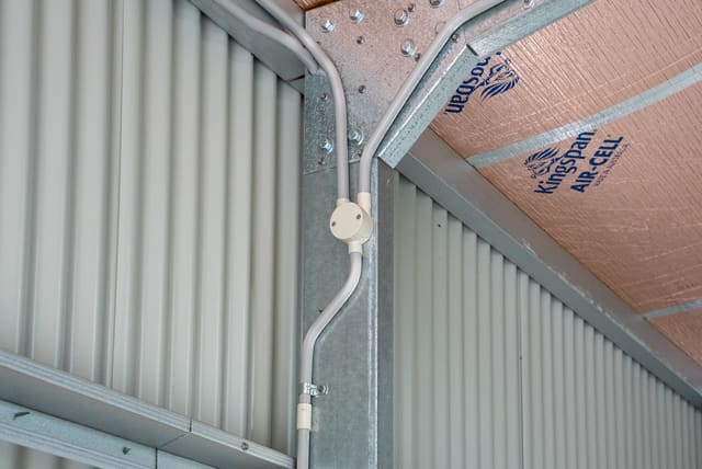 Conduit and a power point run neatly inside a steel shed